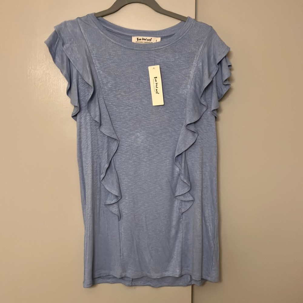 Light blue short sleeved flutter top